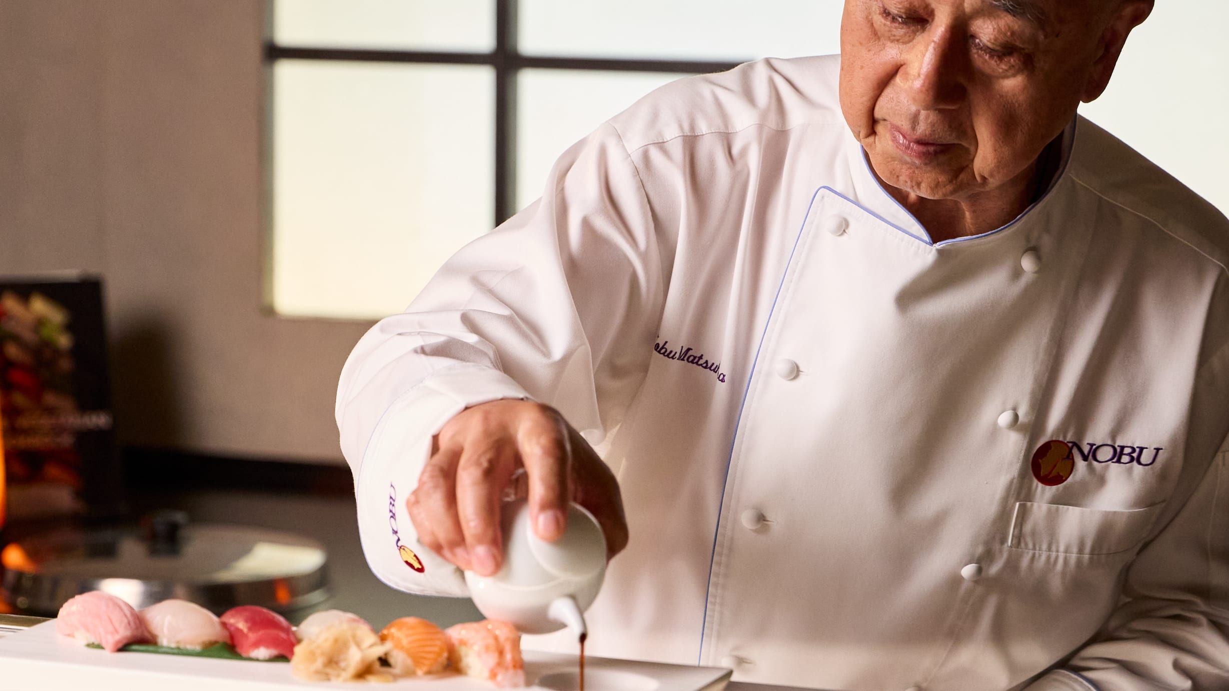 Nobu_san_Serving_A_Selection_Of_Nigiri_Sushi