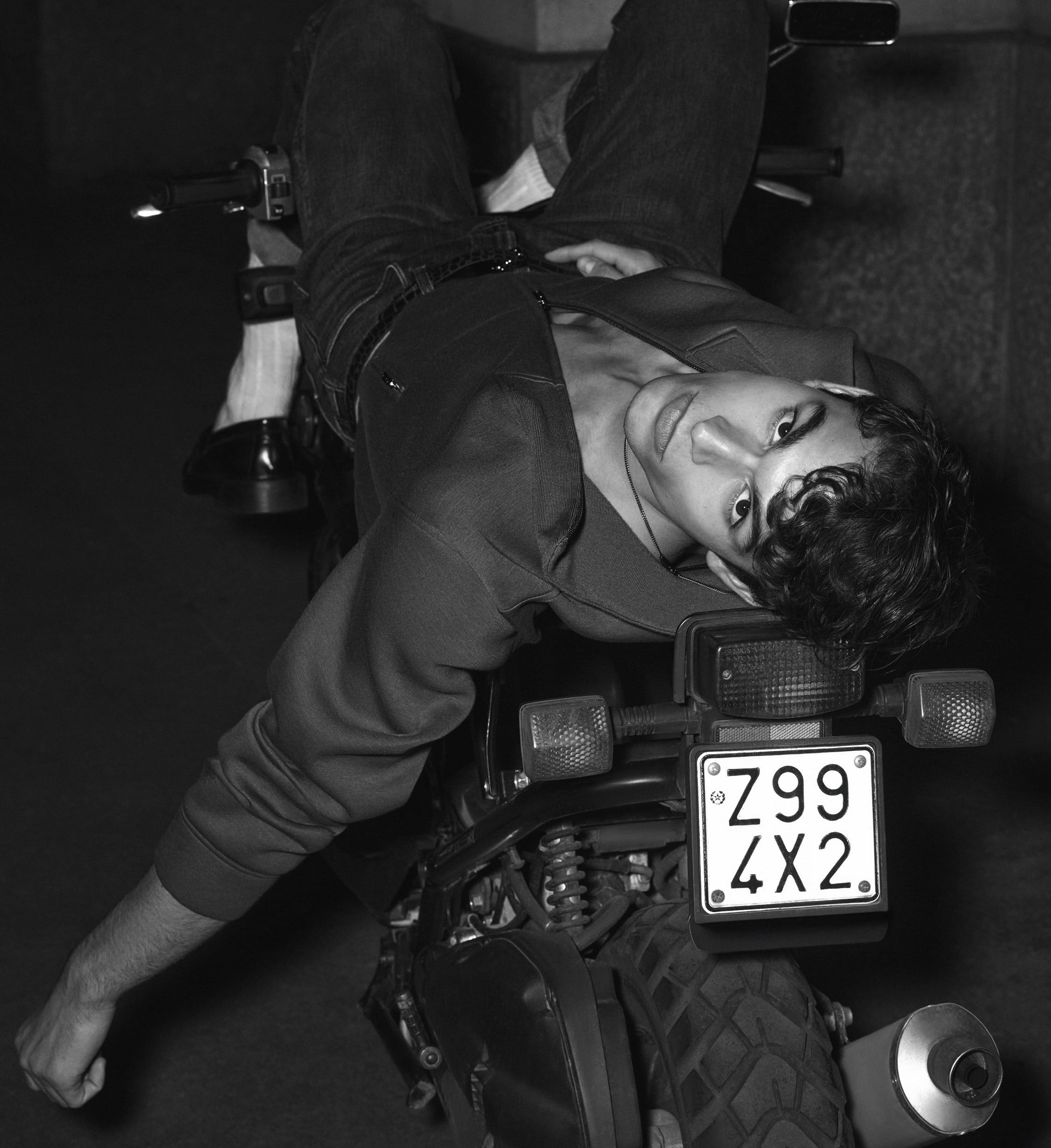 Man lying on a motorcycle