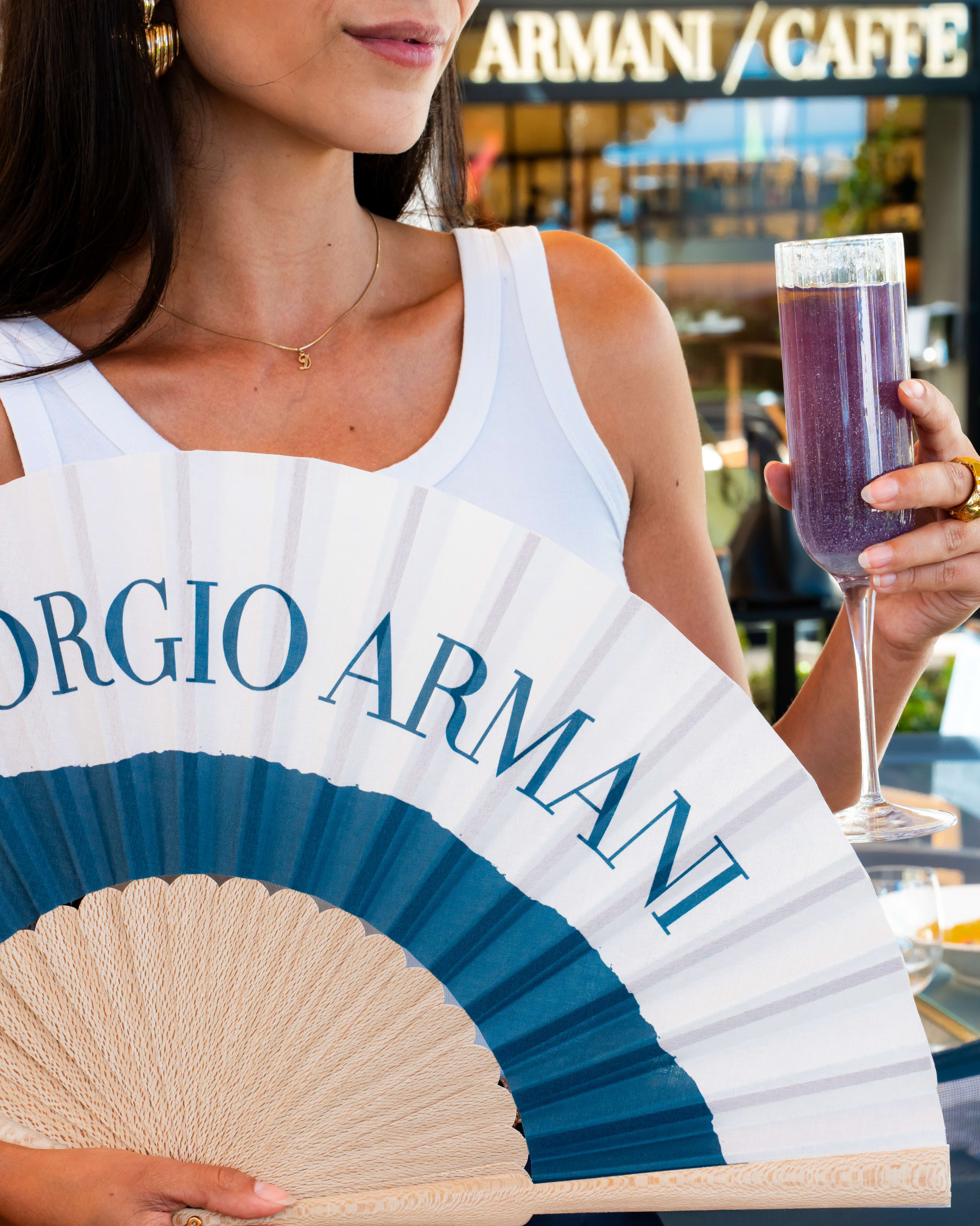 Girl_Holding_Cocktail_On_Cannes_Terrace