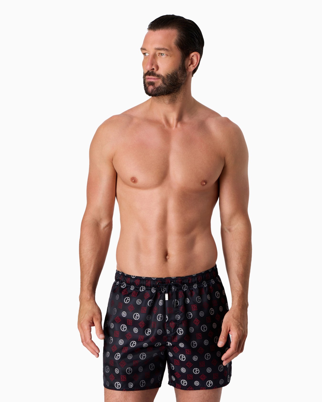 Swim trunks with an all-over logo jacquard Slide 1
