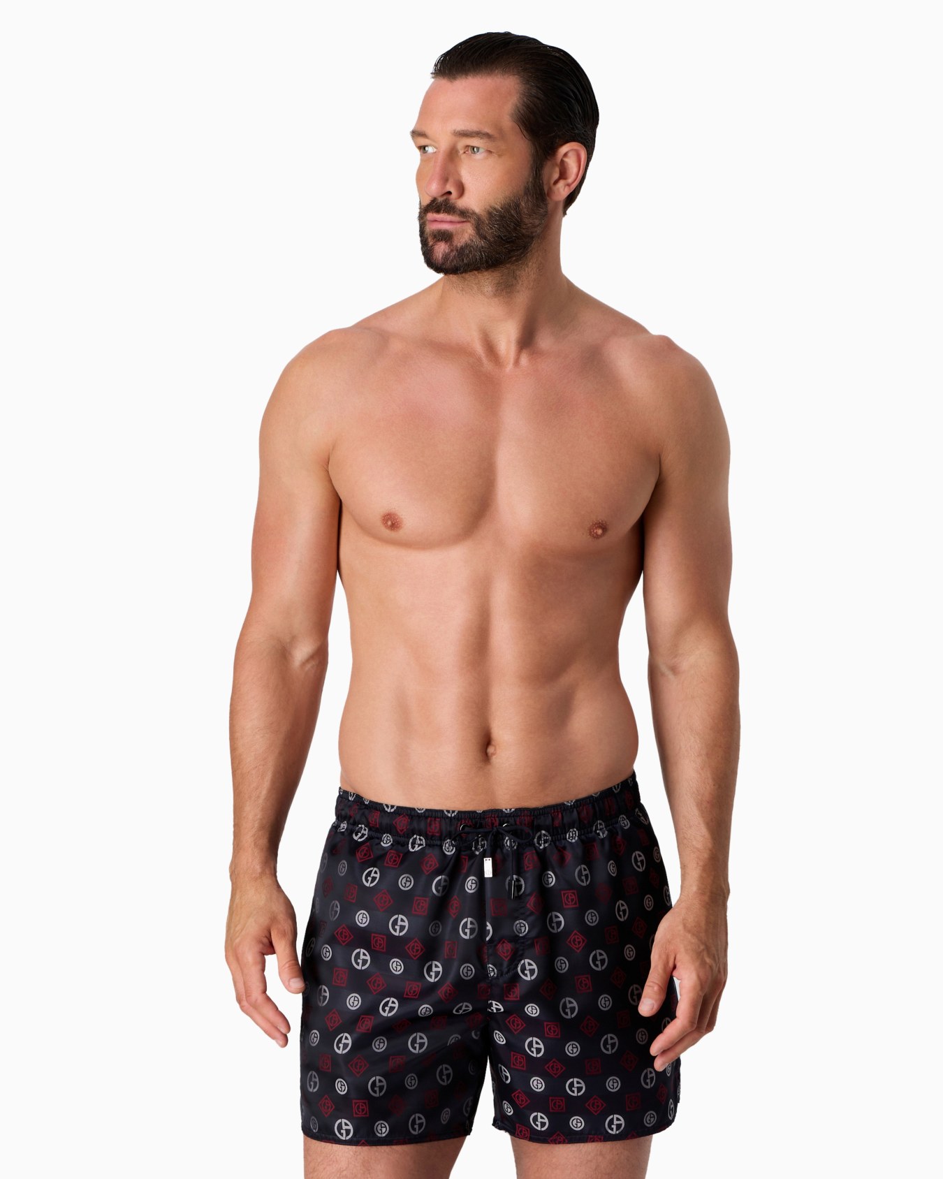 Swim trunks with an all-over logo jacquard Slide 1