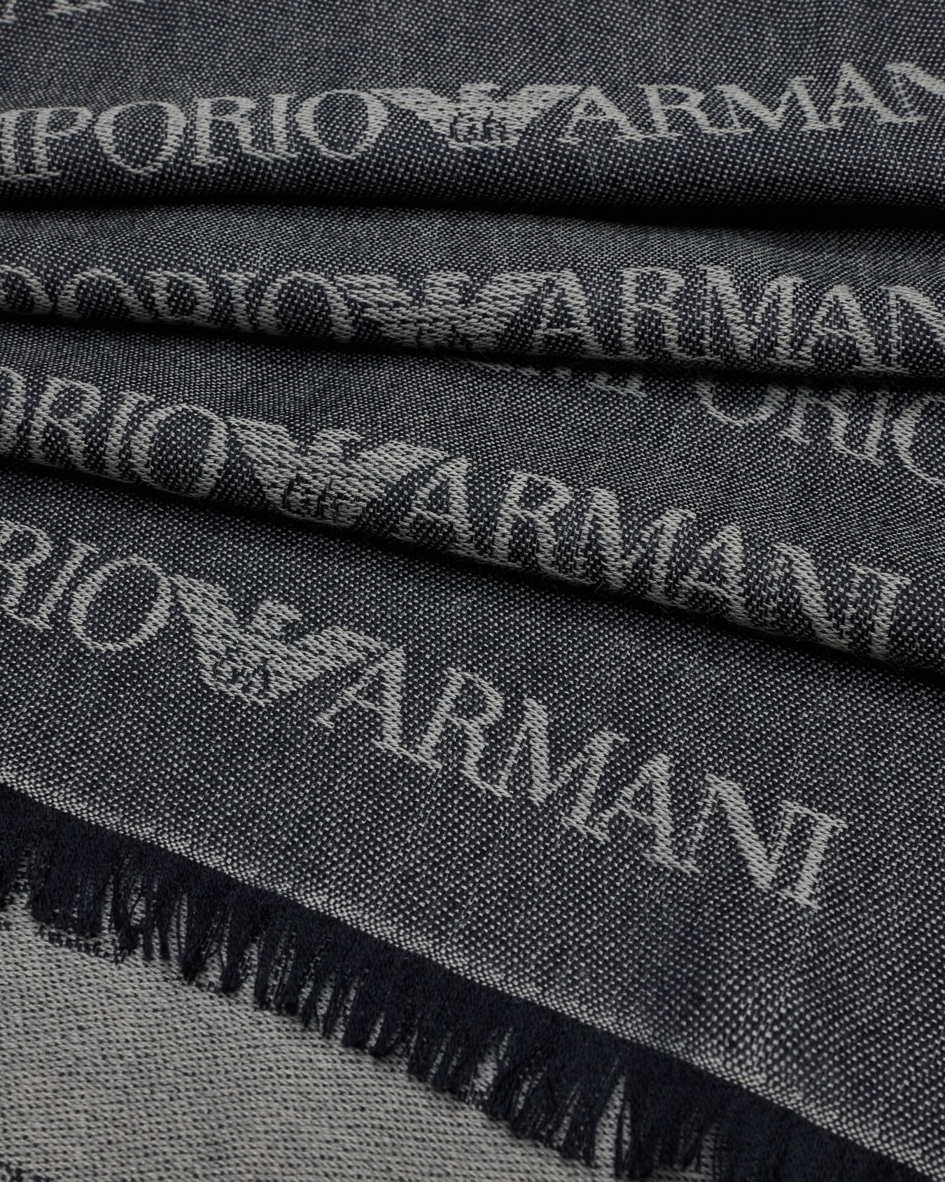 Virgin-wool blend scarf with jacquard logo lettering and fringes Slide 1