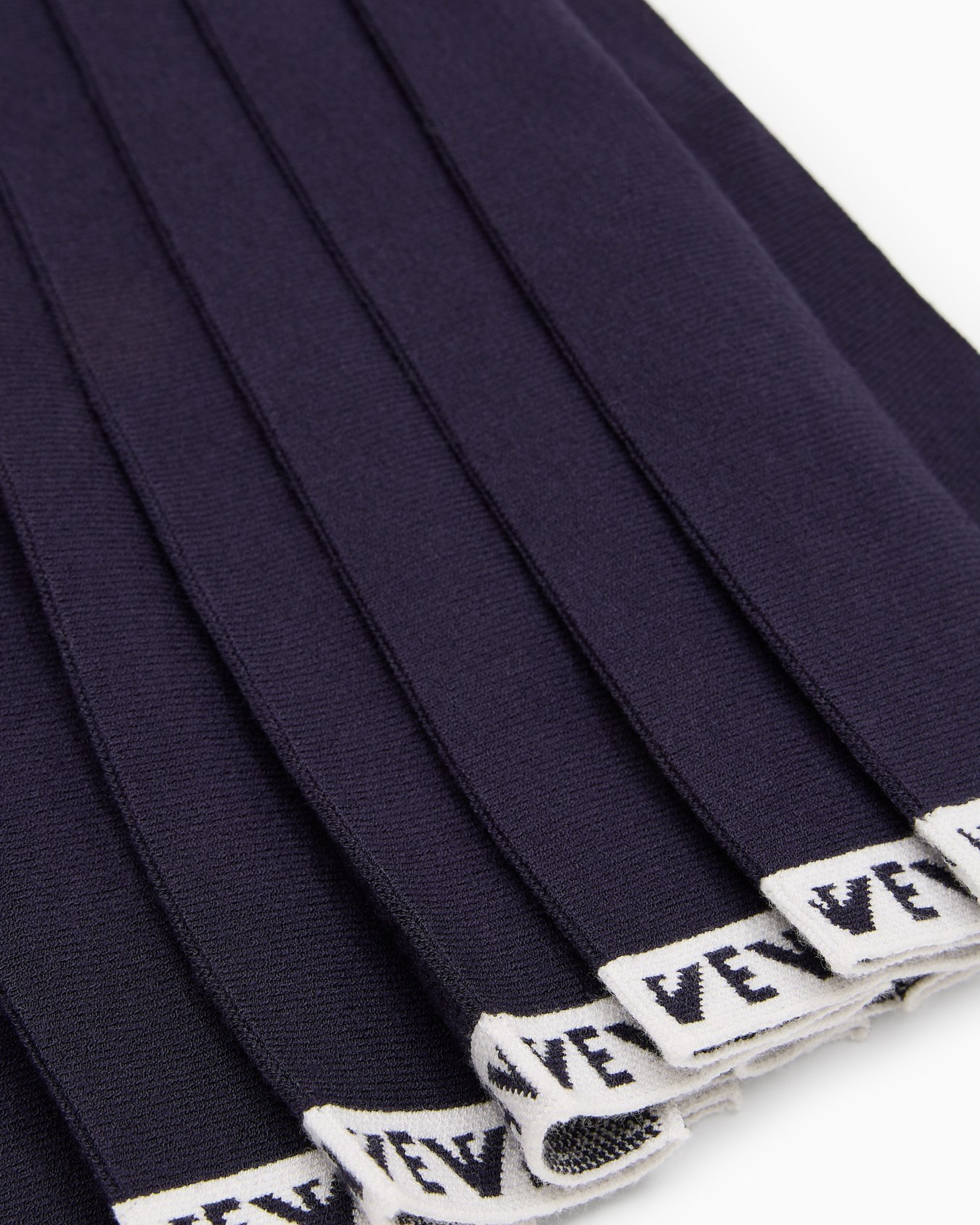 Pleated knit skirt with logo trim Slide 1