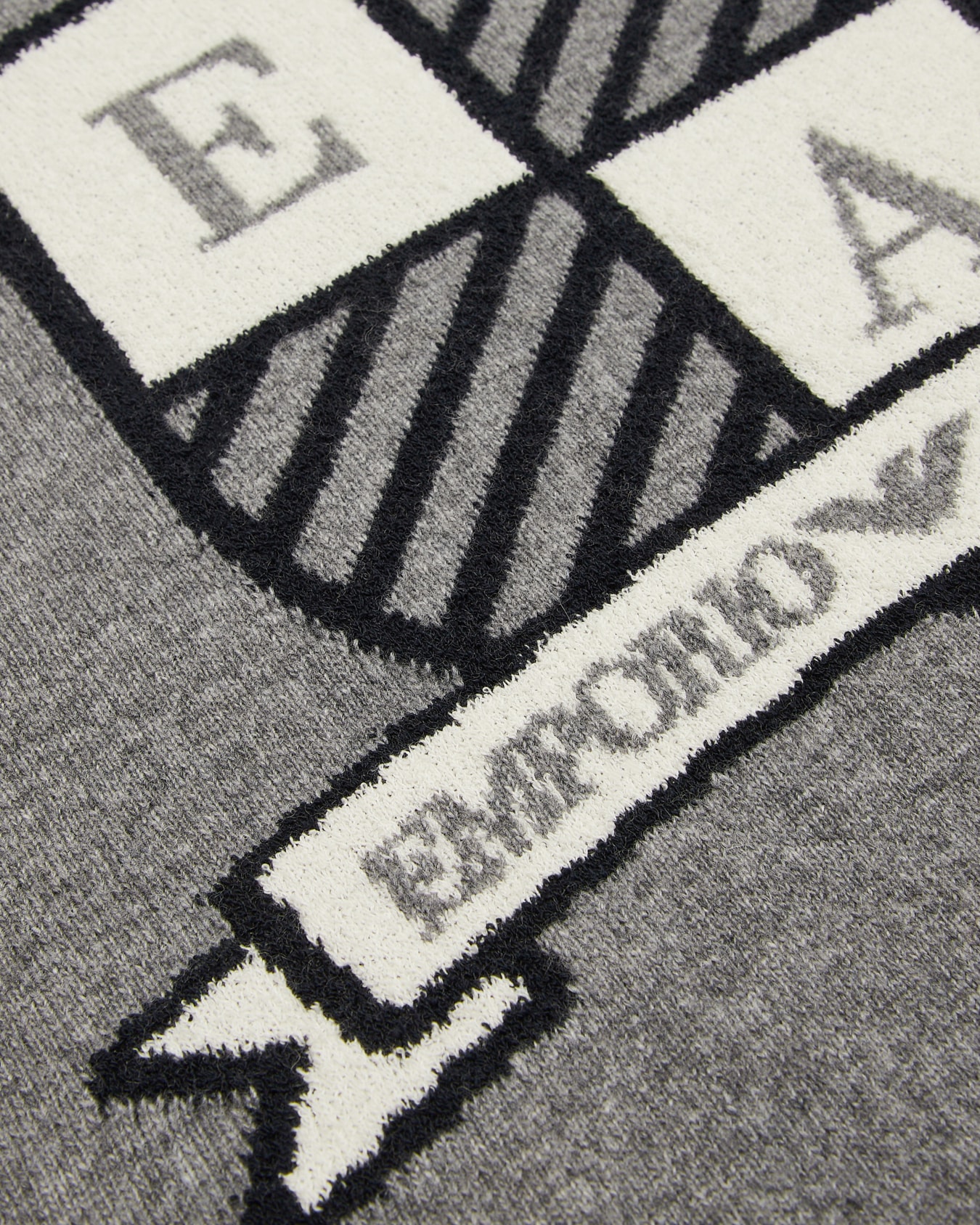 Virgin wool-blend jumper with jacquard logo crest Slide 1