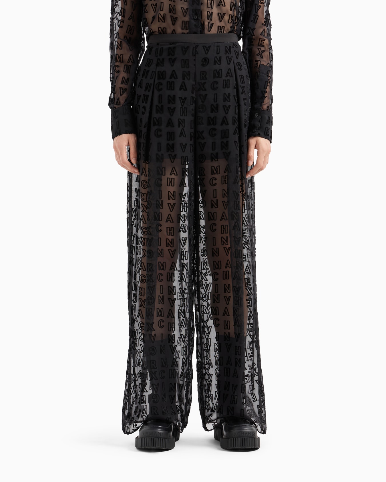 Sheer wide leg trousers with allover logo Slide 1