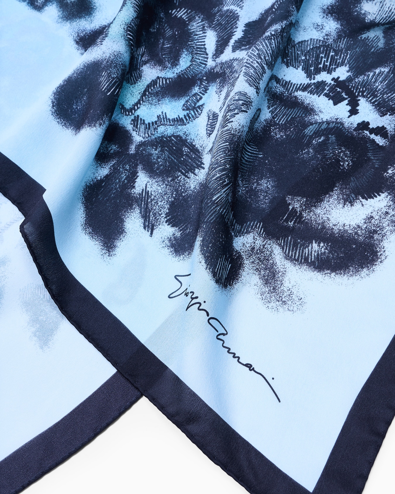 Silk foulard with a floral print Slide 1