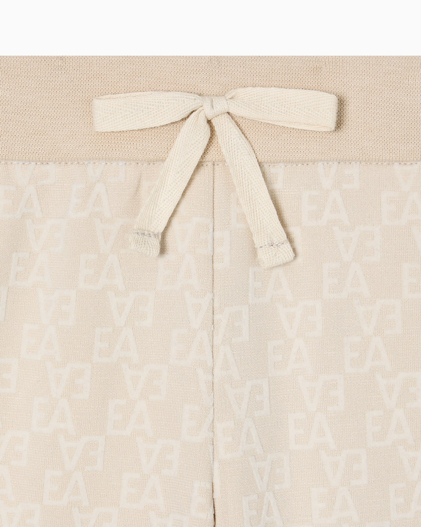 Interlock jersey trousers with all-over flocked EA logo Slide 1