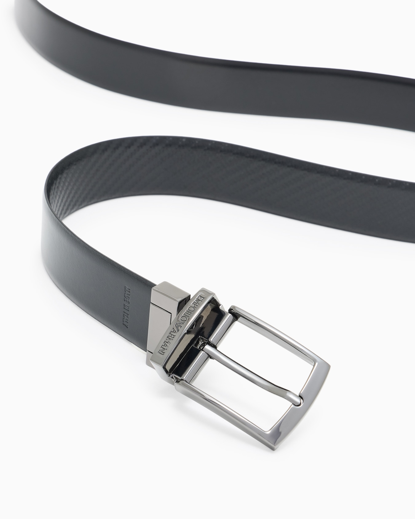Reversible leather belt with embossed motif Slide 1