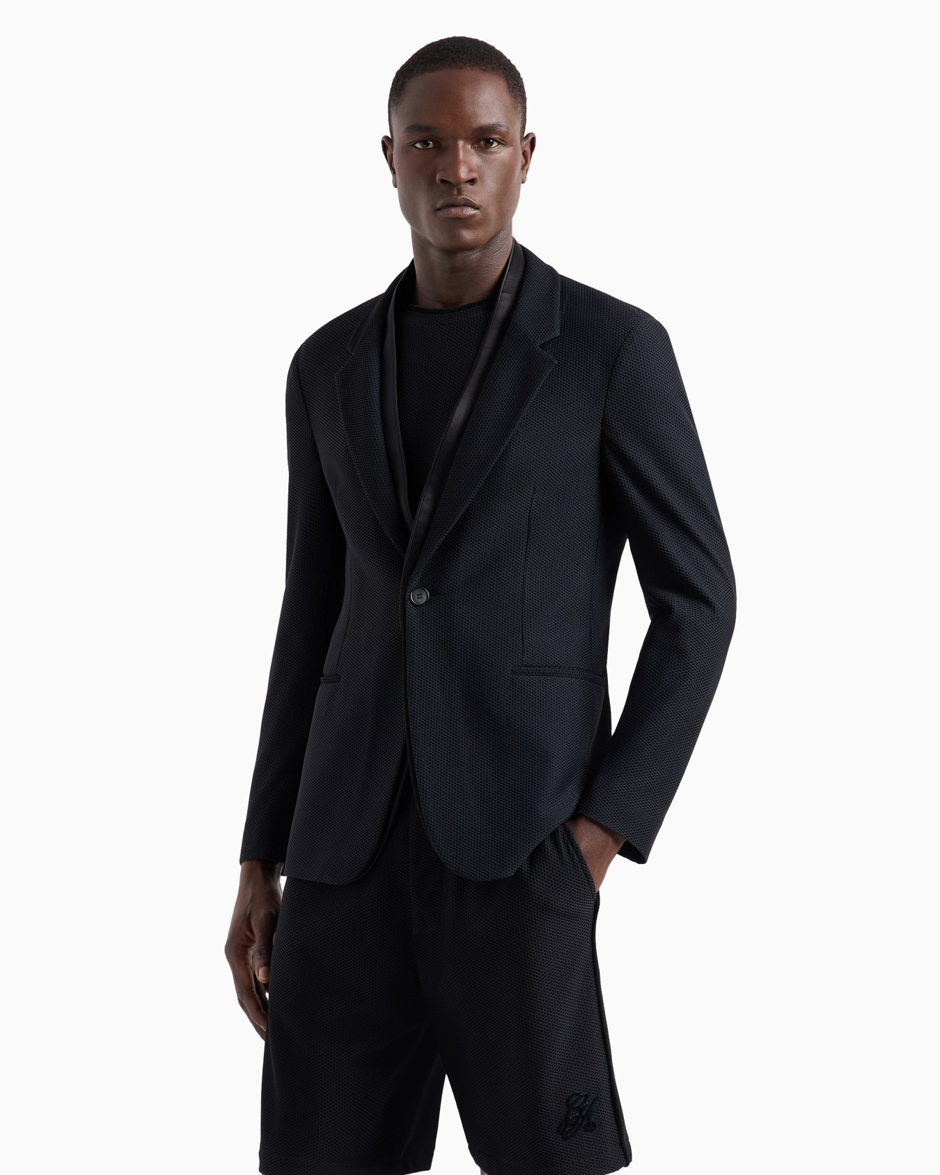 Single-breasted jacket in technical waffle fabric Slide 1