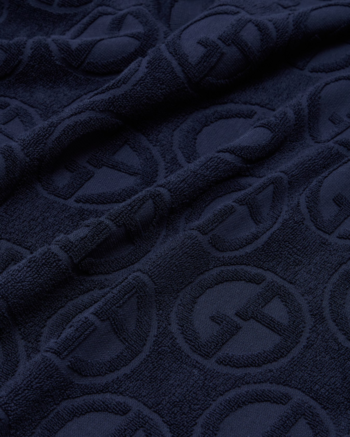 Beach towel in monogram terry cotton Slide 1