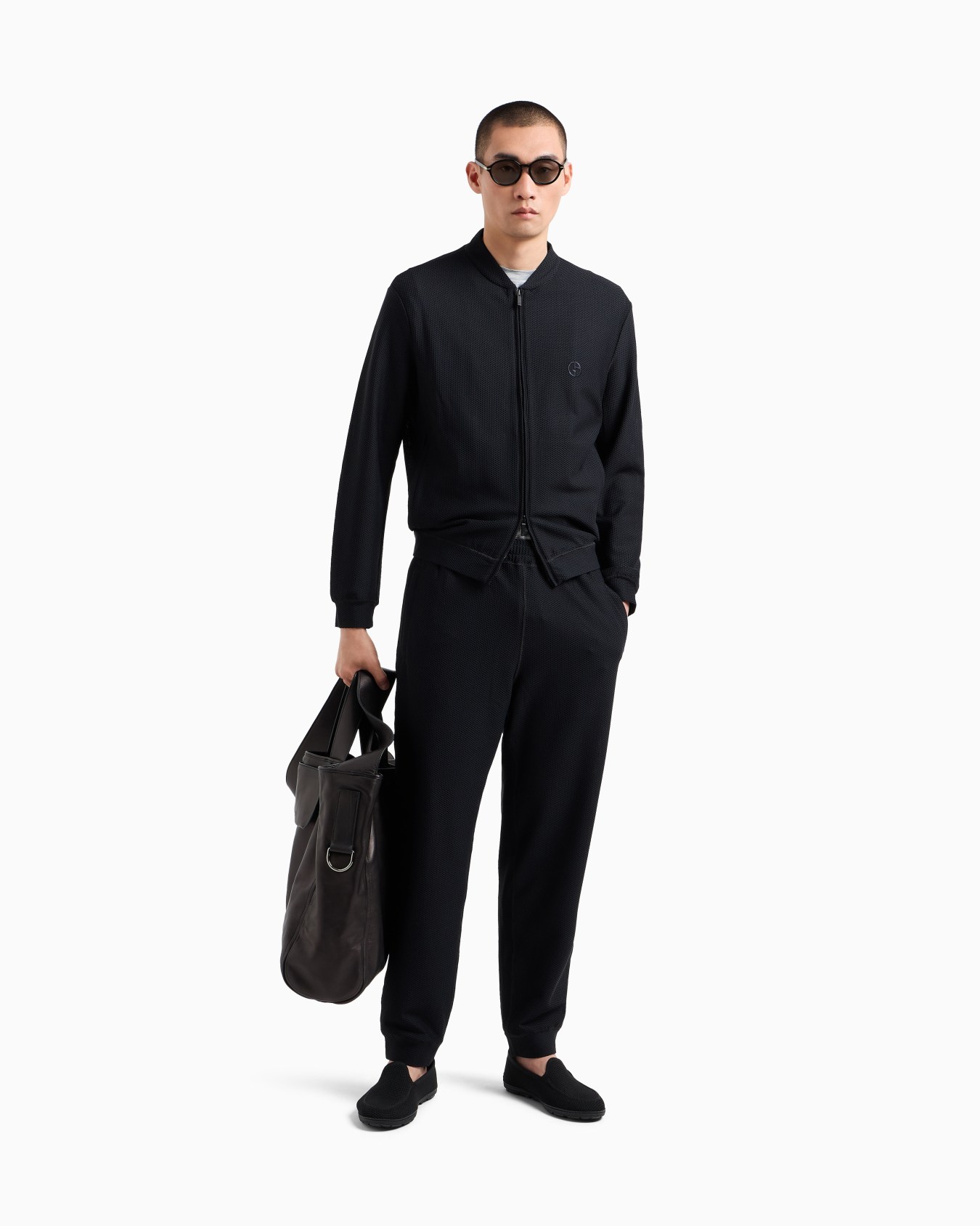 Joggers in technical waffle fabric Slide 1