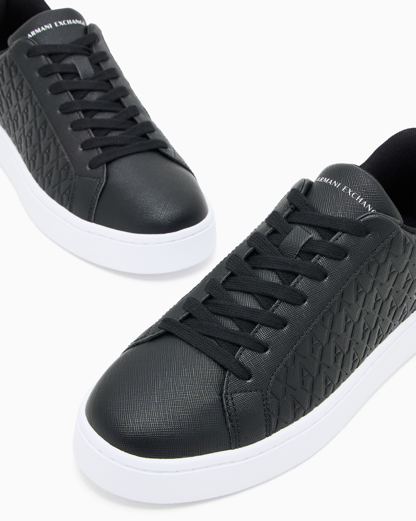 Lace-up sneakers with allover embossed logo Slide 4