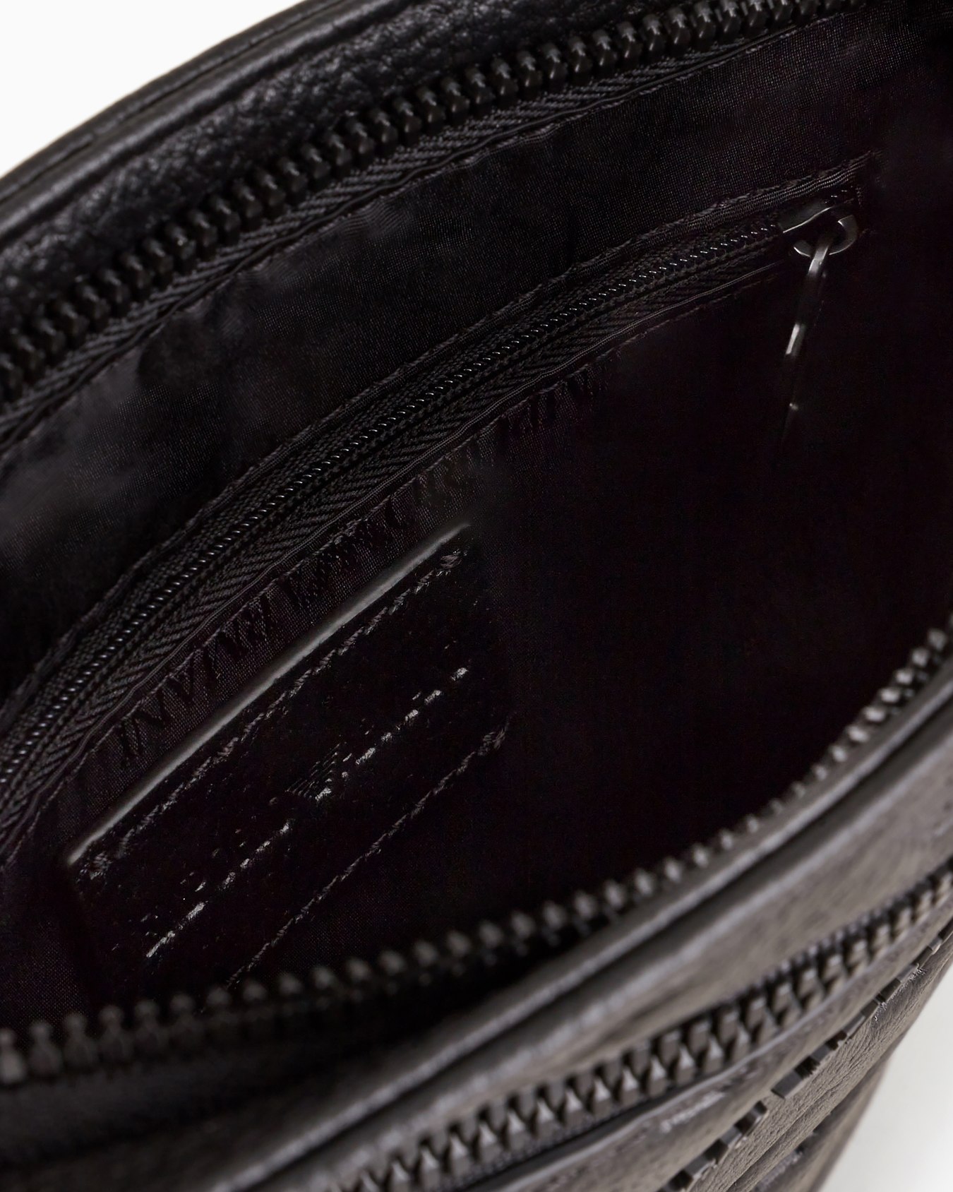 Flat leather shoulder bag with all-over embossed eagle Slide 3