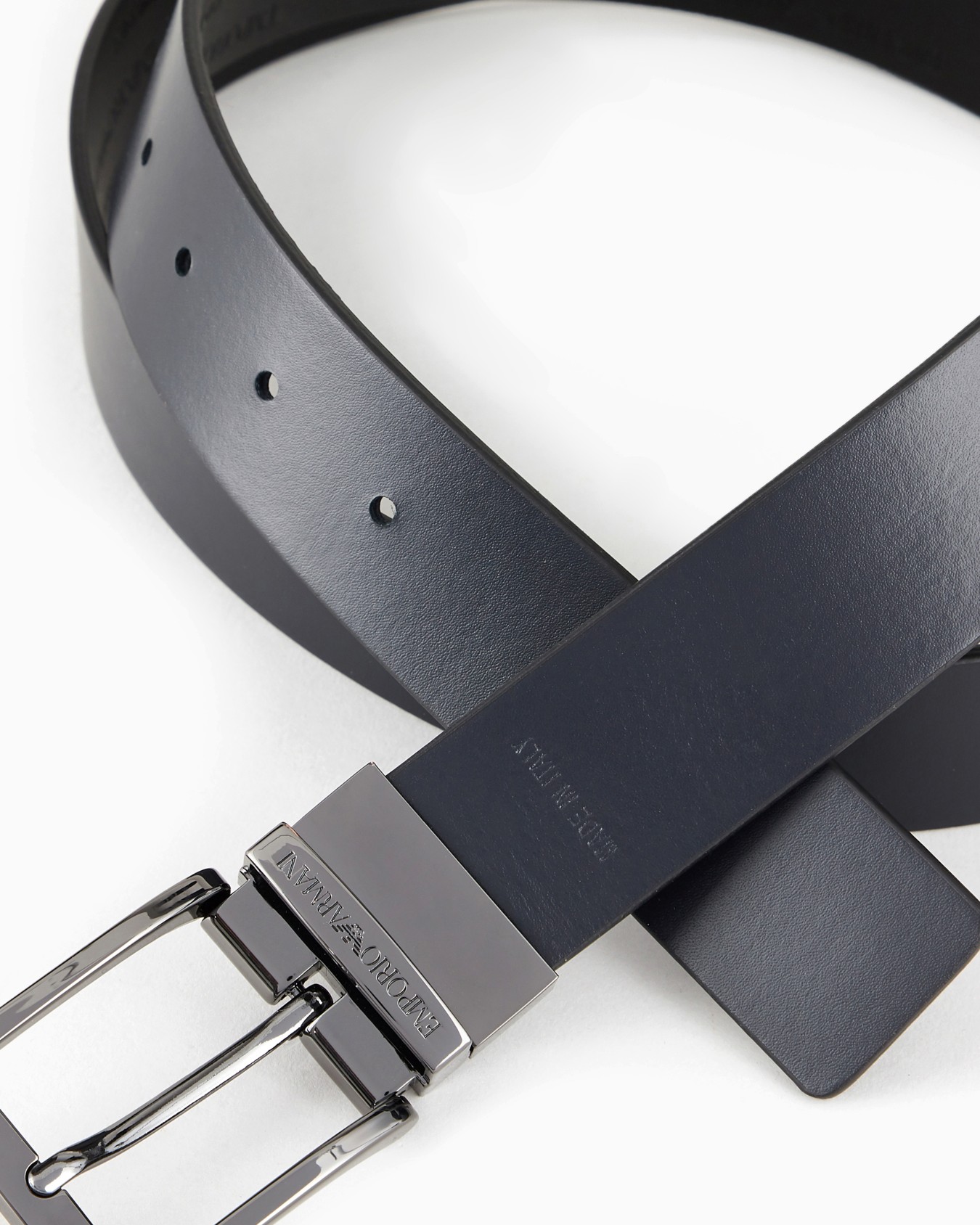 Reversible leather belt with all-over embossed lettering Slide 1