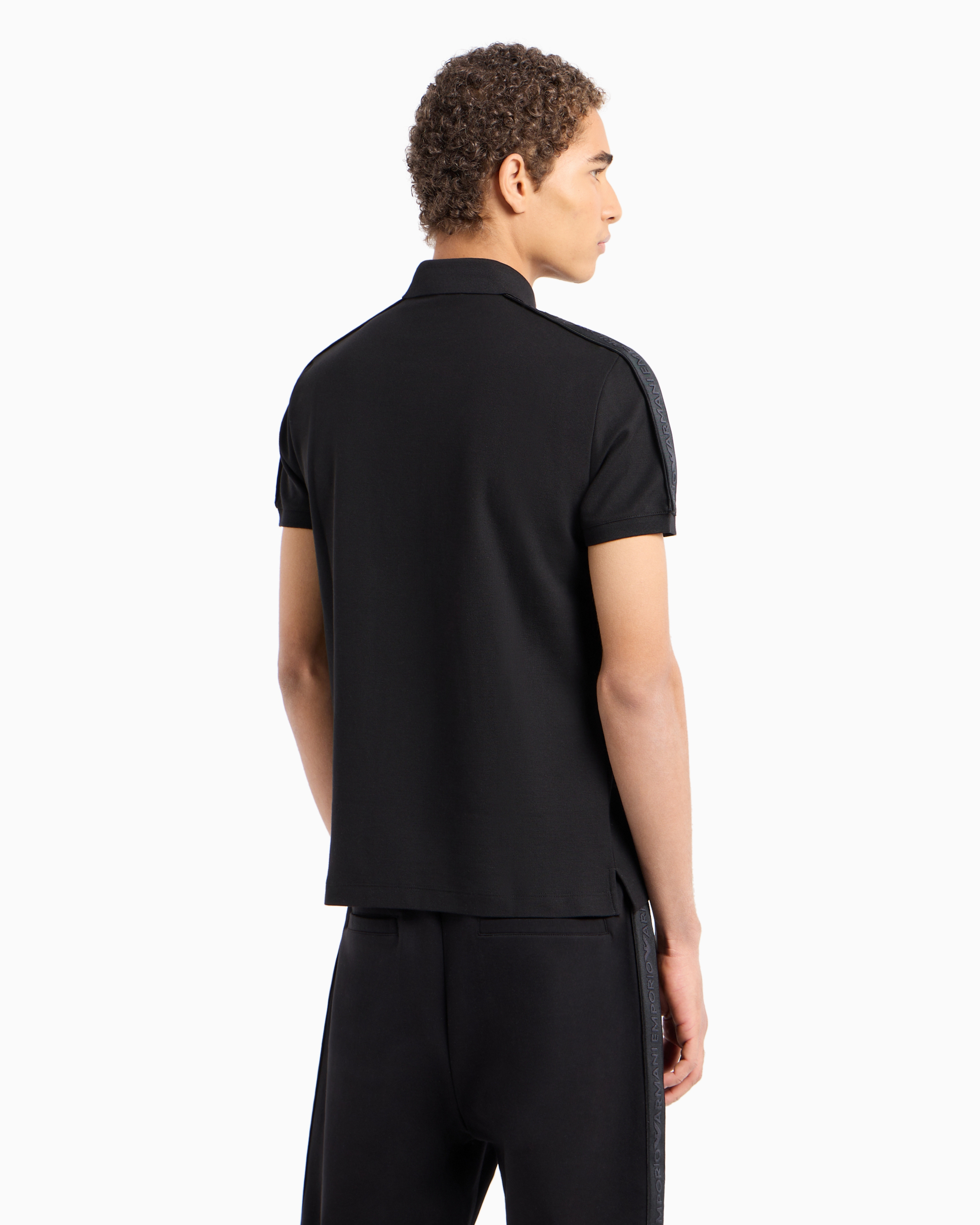 Shop Emporio Armani Jersey Polo Shirt With Logo Tape In Black