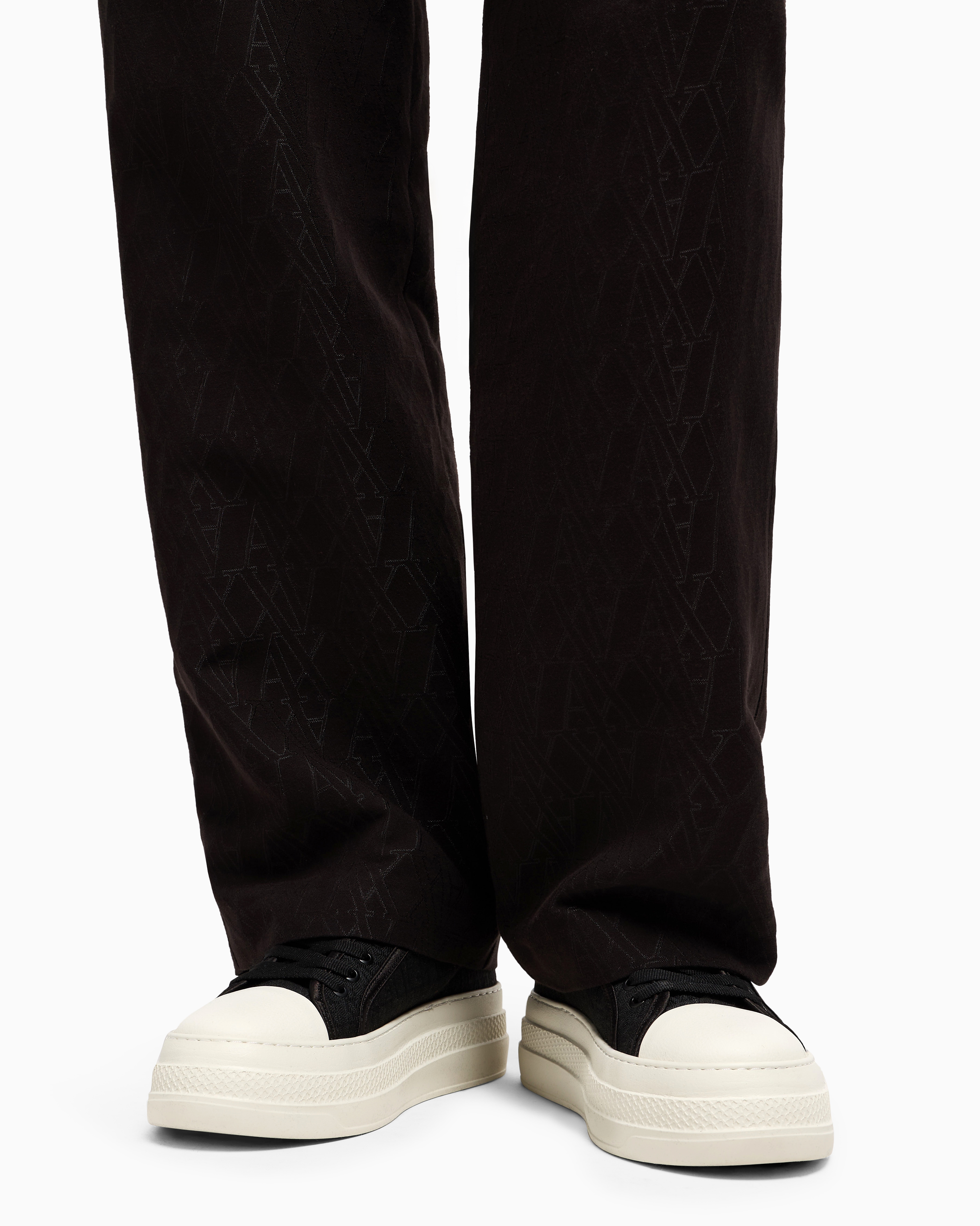 Pleated trousers with allover logo